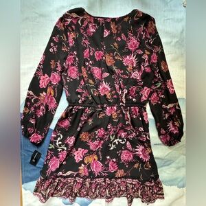 Floral ruffle dress that hits just above the knee.